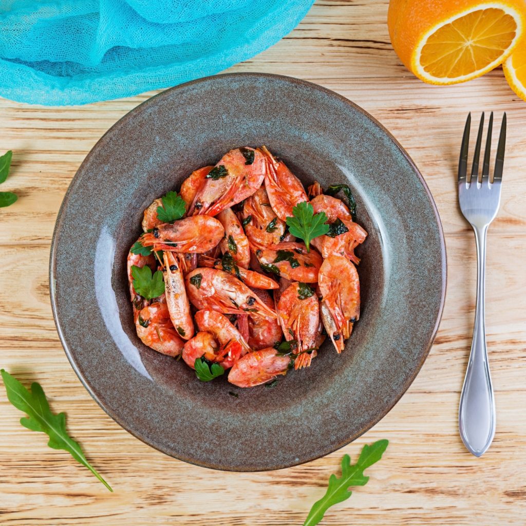 fried-shrimps-with-spicy-orange-sauce-on-wooden-background-1024x1024